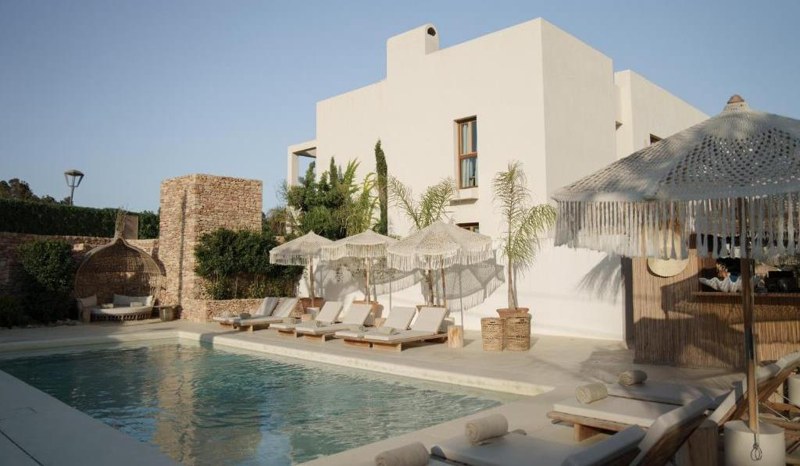 White Mediterranean residence with a pool and stone terrace in Ibiza